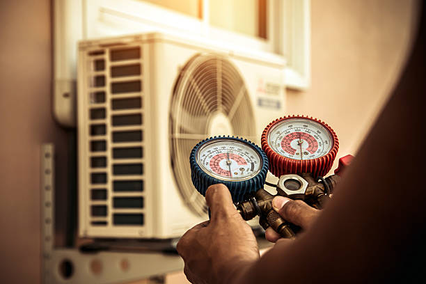 Professional Heat Pump Repair technician working in Roanoke, IN